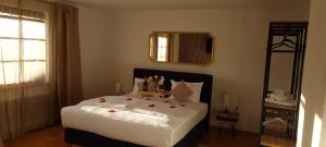 a bedroom with a bed with flowers on it at aNNa s Cozy Home with Private Forest, Canopy Terrace & Parking, near Red Bull Ring in Sankt Michael in Obersteiermark