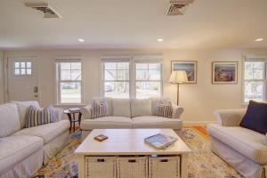 a living room with two couches and a coffee table at Walk to Earle Rd Beach Incredible Patio in Harwich +31 photos