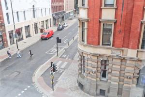 an aerial view of a city street with a red van at Alliance House - Hopewell in Bristol