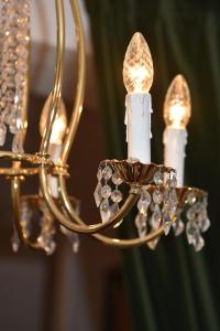 a close up of a chandelier with crystals at Pension Langerspacher in Grabenstätt