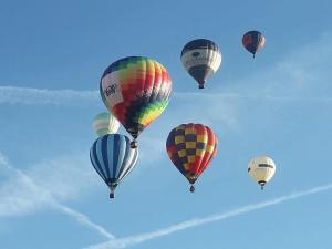 a group of hot air balloons flying in the sky at Spacious 2 storey penthouse flat, fantastic views! in Bristol