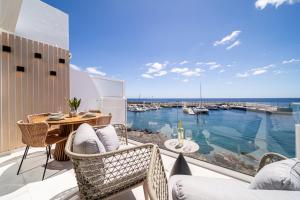 a balcony with a view of a marina at Casa Boga in Puerto del Carmen