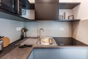Kuchyňa alebo kuchynka v ubytovaní Casa Sasù - Design modern apartment