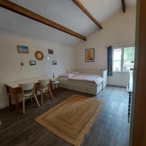 a bedroom with a bed and a table and chairs at Mas Constantin in Salin-de-Giraud +36 photos
