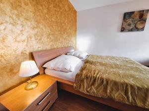 A bed or beds in a room at Penzión Villa Agnes
