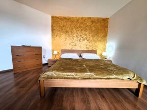 A bed or beds in a room at Penzión Villa Agnes