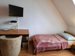 A bed or beds in a room at Penzión Villa Agnes