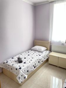 a bedroom with a bed and a window at LaoVardi Hotel in Gori