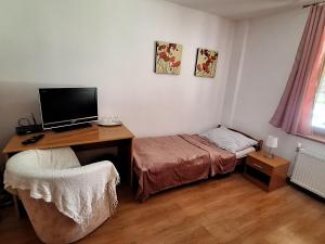 A bed or beds in a room at Penzión Villa Agnes