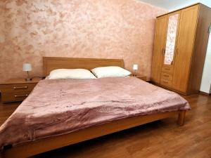 A bed or beds in a room at Penzión Villa Agnes