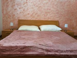 A bed or beds in a room at Penzión Villa Agnes