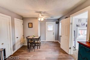 a kitchen and dining room with a table and chairs at *H* NEW! Downtown Cottage Newly Renovated! * in Colorado Springs