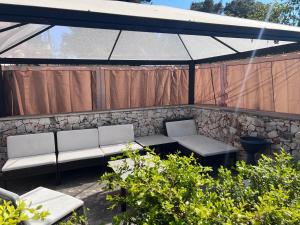Posezení v ubytování Villa L'Ottagono con cucina parcheggio privato telecamerizzato e wifi
