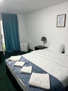 Postel nebo postele na pokoji v ubytování BAM Hotel