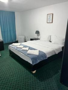 Postel nebo postele na pokoji v ubytování BAM Hotel