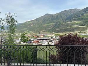 a view of a town with mountains in the background at Weingut Köfelgut - Turris Vini in Kastelbell-Tschars +27 photos