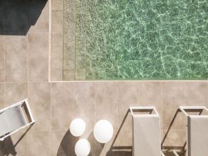 a bathroom with a green board on the wall at Almarossa Luxury Villas in Vourvoúlos