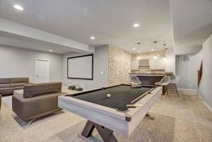 a living room with a pool table in it at 4BR Mountain views - Movie Theater - Pool Table in Monument