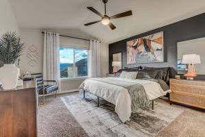 a bedroom with a bed and a ceiling fan at Room to Spread Out & Deck with Mountain Views in Monument