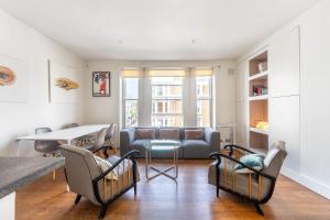 a living room with a couch and a table at Notting Hill, Portobello, Kensington Chelsea in London