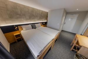 Postel nebo postele na pokoji v ubytování Villars Lodge