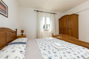 Posteľ alebo postele v izbe v ubytovaní Lovely House LINDI in Poreč