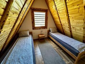 Postel nebo postele na pokoji v ubytování Vlasic Odmor - Villa Krajina III