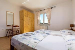 Posteľ alebo postele v izbe v ubytovaní Lovely House LINDI in Poreč