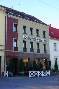 a hotel alexandra in front of a building at Hotel Alexandra in Olesno