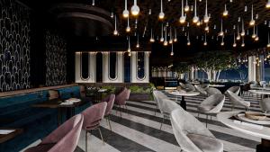 a restaurant with chairs and tables and chandeliers at RENEX HOTELS in Antalya