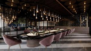 a dining room with a long table and chairs at RENEX HOTELS in Antalya