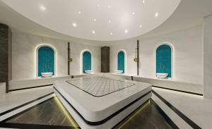 a room with blue windows and a large table at RENEX HOTELS in Antalya