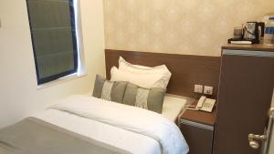 Katil atau katil-katil dalam bilik di Seasons Hotel - Causeway Bay