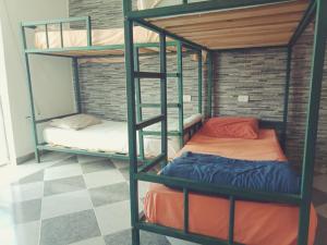 a room with two bunk beds and a bed at My Hostel in Dahab - Dive center in Dahab