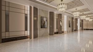 a large hallway with chandeliers in a building at RENEX HOTELS in Antalya