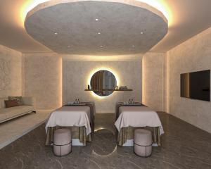 a room with two massage tables and a couch at RENEX HOTELS in Antalya