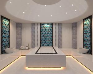 a room with two sinks and a table in front of windows at RENEX HOTELS in Antalya