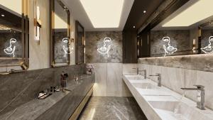 a bathroom with two sinks and two mirrors at RENEX HOTELS in Antalya