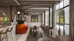 a lobby with chairs and a table in a building at RENEX HOTELS in Antalya