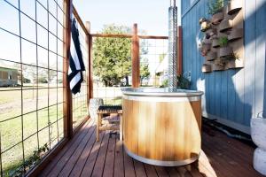 a hot tub on the deck of a house at 6Sixteen The Banks in Richmond