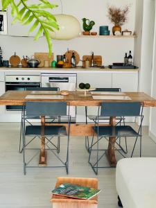 a kitchen with a wooden table and chairs at CASA MIRABEL in Villaverde