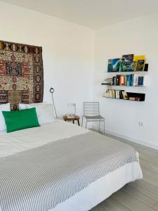 a bedroom with a bed and a book shelf at CASA MIRABEL in Villaverde