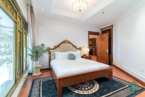 Giường trong phòng chung tại Paradise Suites Trich Sai