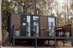 a tiny house is sitting on a trailer at Tiny Tamborine 2 in Wongawallan