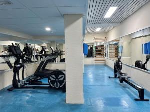 a gym with several treadmills and cardio machines at Holiday Club Puerto Calma in Puerto Rico de Gran Canaria