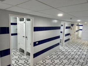 a room with blue and white stripes on the wall at Holiday Club Puerto Calma in Puerto Rico de Gran Canaria