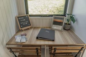 a table with a laptop and a window at Mary Valley Views in Amamoor