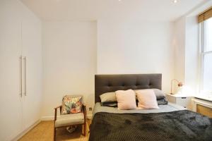 Postel nebo postele na pokoji v ubytování Notting Hill Guest House
