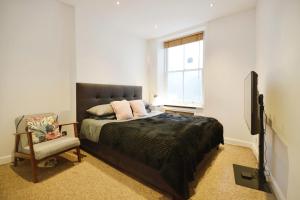 Postel nebo postele na pokoji v ubytování Notting Hill Guest House