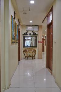 a hallway with a bench in a building at Bentley Hotel, Marine Drive in Mumbai